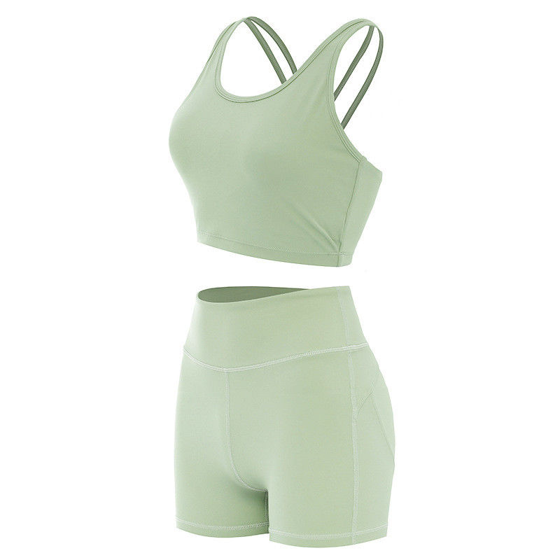 Os sutiãs fêmeas dos esportes do short de Lifying da extremidade marcaram o Activewear sem emenda dos grupos do exercício