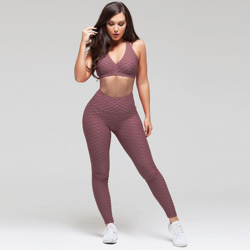 A ioga marcada do Gym do Sportswear veste caneleiras sem emenda do exercício para mulheres
